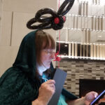 Luna Whoticore reading from the DTC at Loscon 46