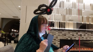 Luna Whoticore reading from the DTC at Loscon 46